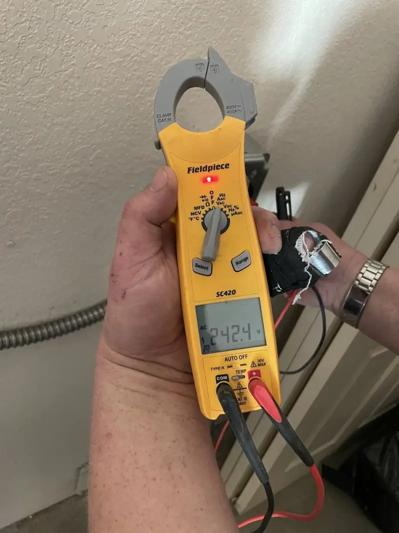 Voltage testing with clamp meter during Aluminum Wiring Replacement in Orem